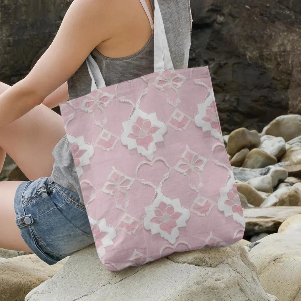 Baby pink Moroccan tote bag placed on rocks at the beach, showing versatile casual style