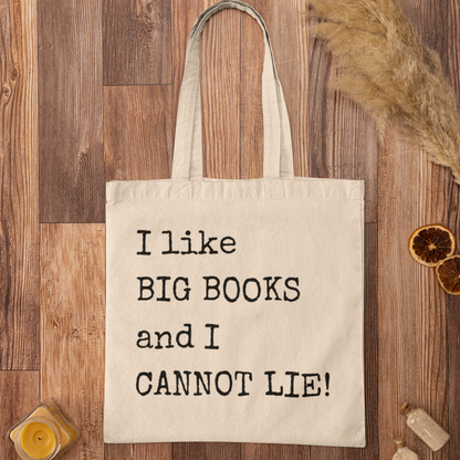 Natural canvas book tote bag with quote “I like BIG BOOKS and I CANNOT LIE!” styled on wooden background