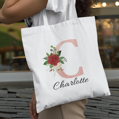 Close-up of Blush Pink and Roses Floral Custom Tote Bag featuring initial C and name Charlotte, ideal for personalized gifts
