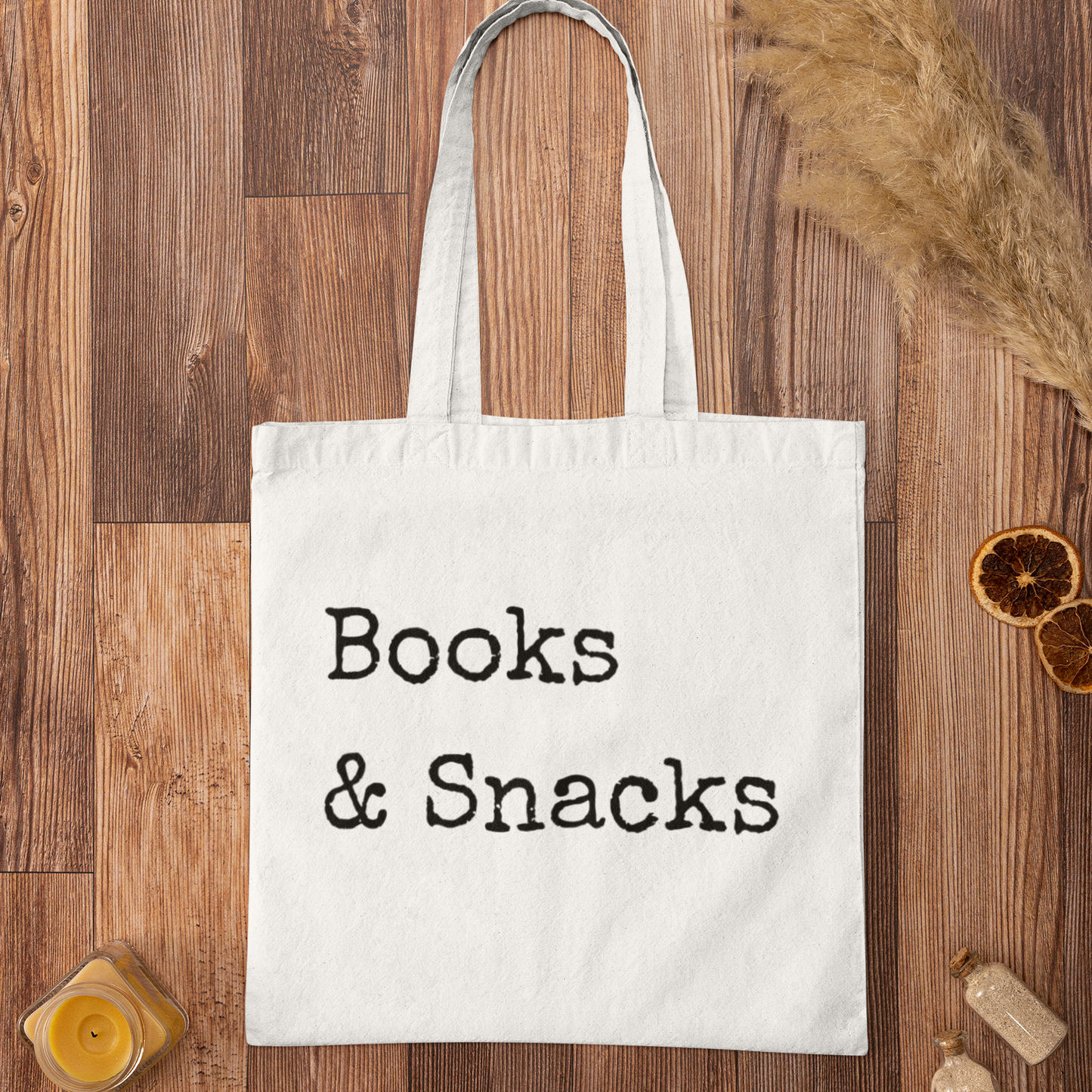 Books and Snacks white minimalist book tote bag flat lay on wooden surface