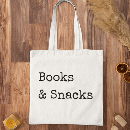 Books and Snacks white minimalist book tote bag flat lay on wooden surface