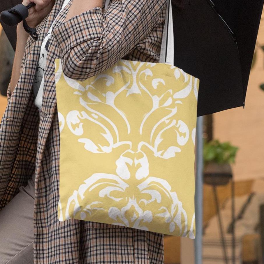 Stylish butter yellow damask pattern tote bag worn with plaid outfit, perfect for casual or office use
