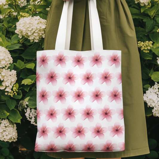 Cherry Blossom Sakura Pink Flower Pattern Tote Bag held by woman in green dress in floral garden