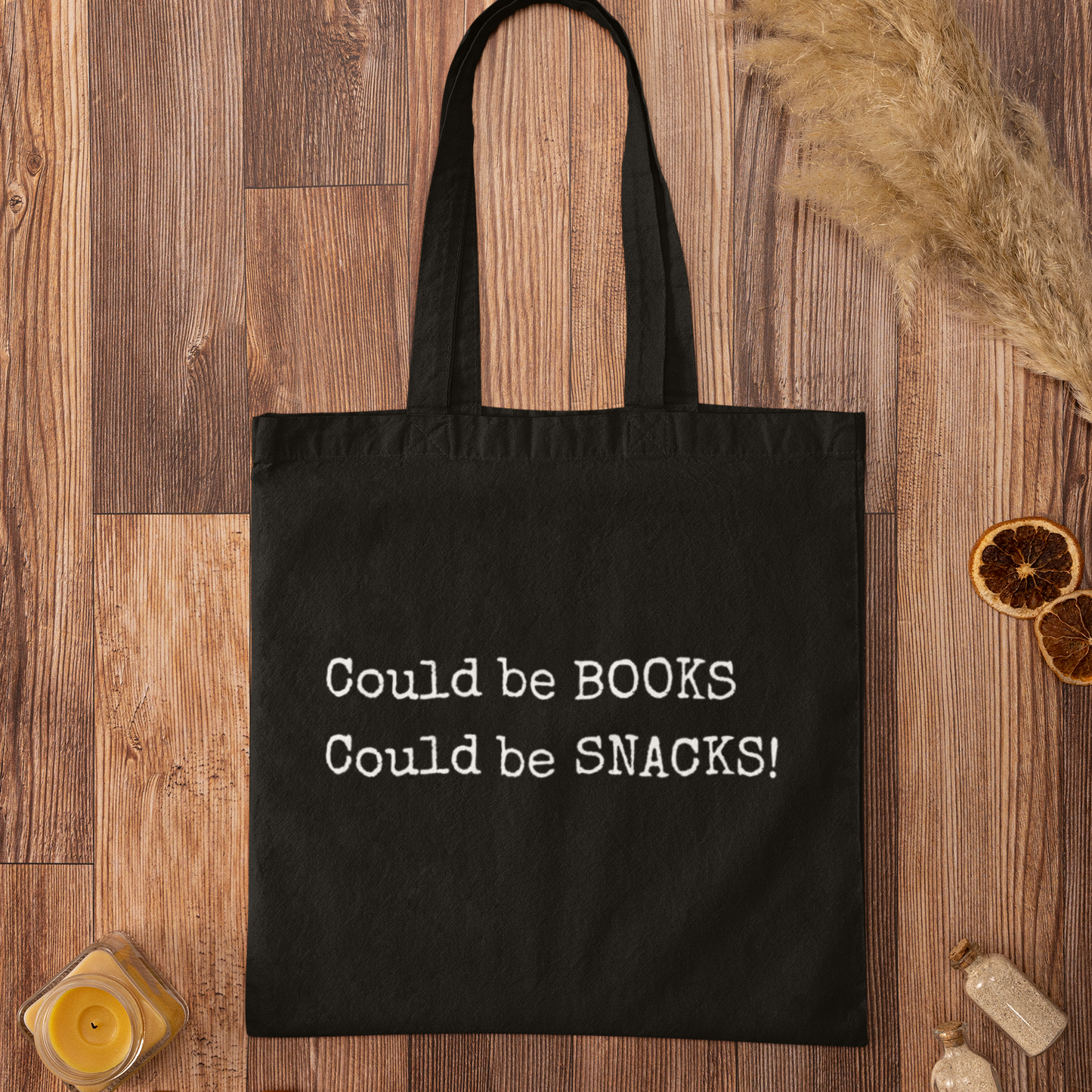 Black Could Be Snacks Book Quotes Minimalist Tote Bag on wooden background, eco-friendly canvas bag for book lovers and snack enthusiasts.