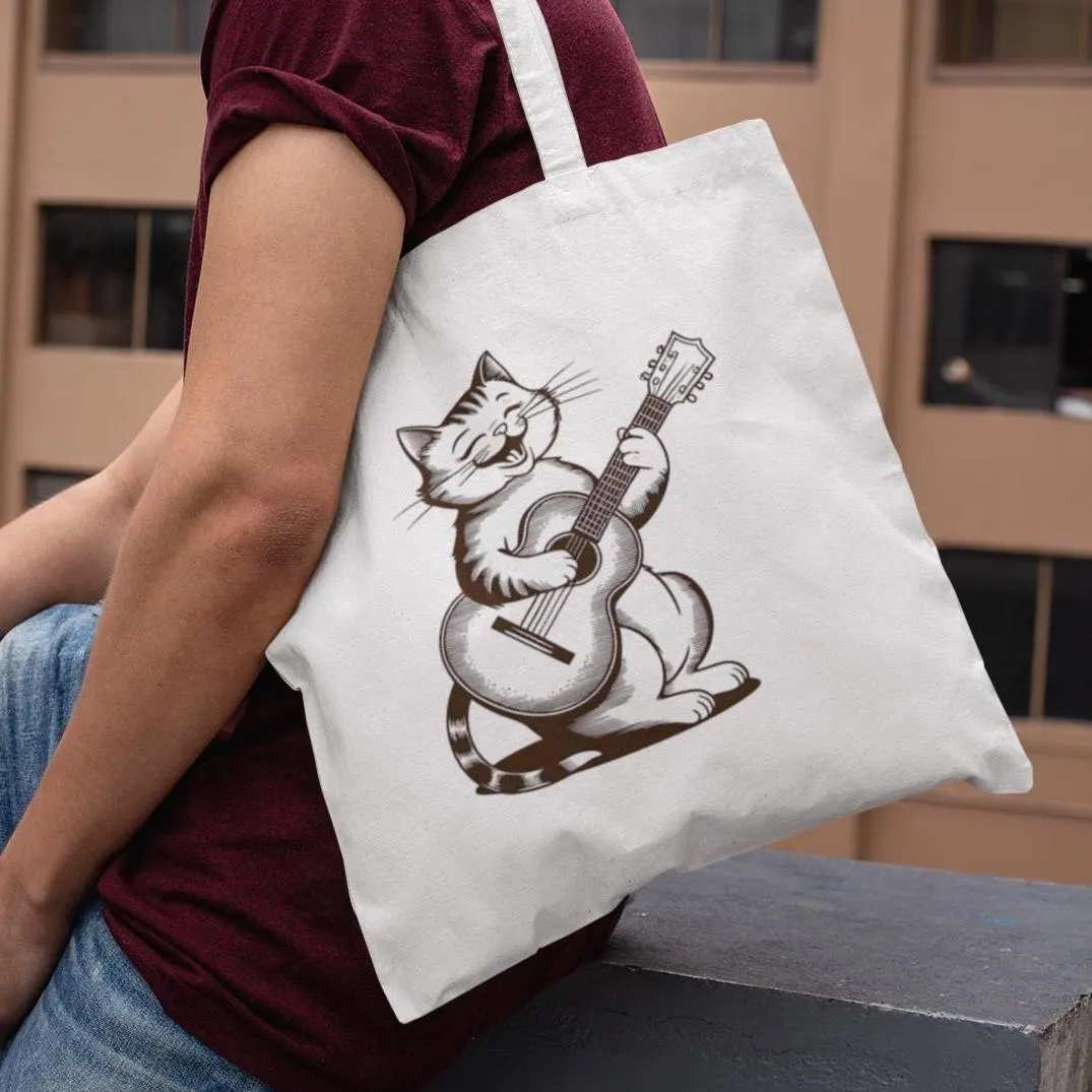 Man sitting outdoors with white Cute Cat With Guitar Minimalist Tote Bag over shoulder