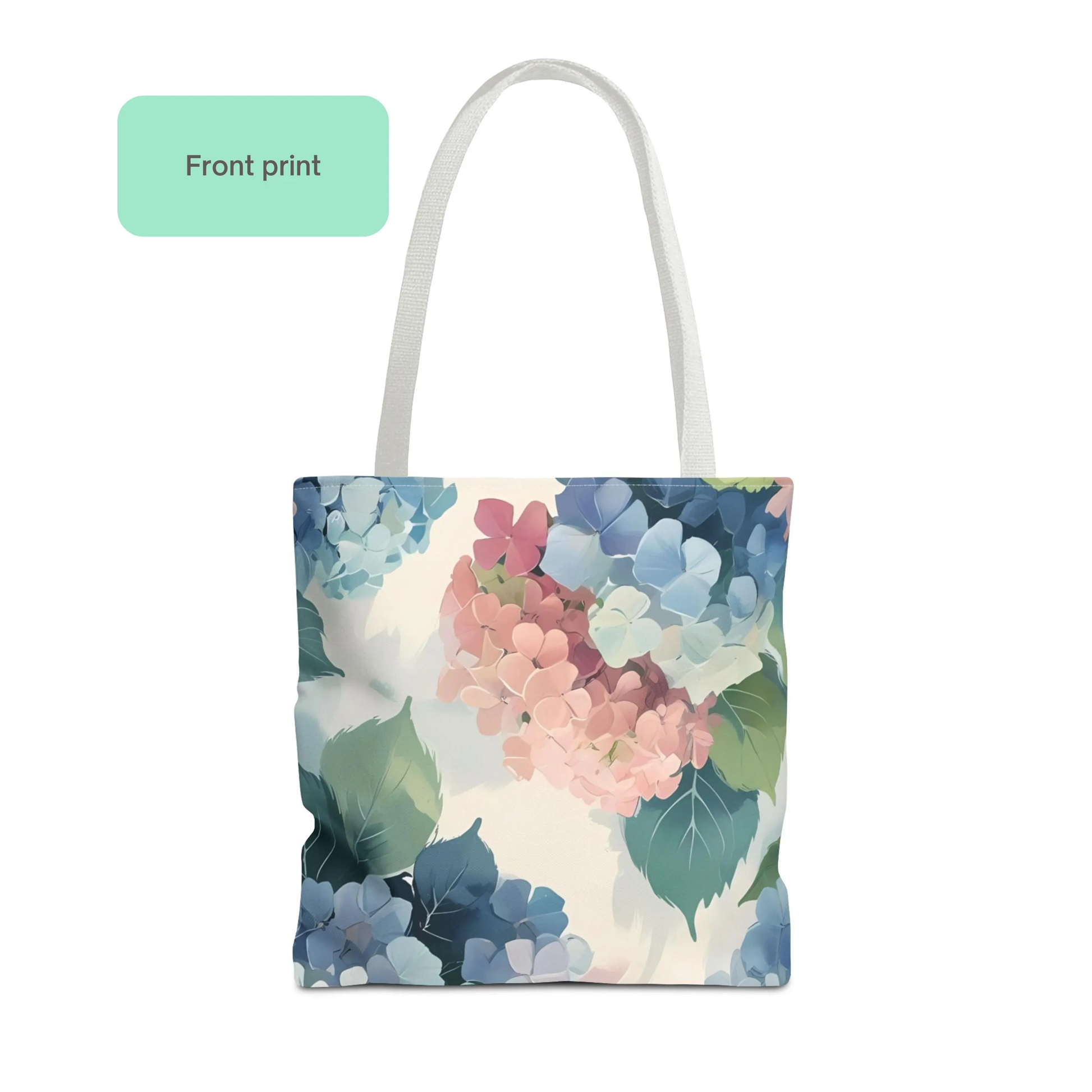Front print of hydrangea pastel floral tote bag, featuring soft blue and pink flower pattern on cream background