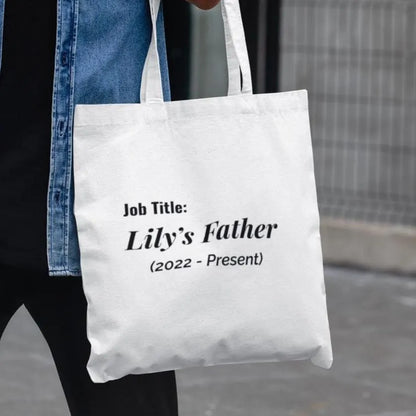 White minimalist design tote bag with Lily’s Father custom Job Title text – new father gift