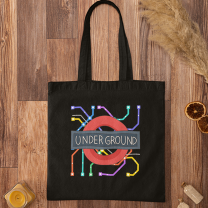Black London Underground map graphic tote bag on wooden background – modern streetwear-inspired design