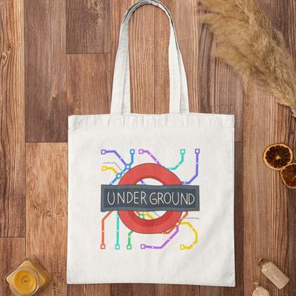 White London Underground map graphic tote bag flatlay on wooden surface – stylish city travel accessory