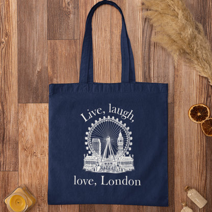 Navy blue Love London City Tote Bag featuring white London Eye and skyline design on wooden background