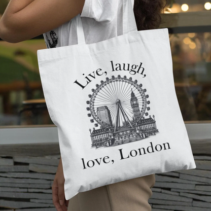 White Love London City tote bag featuring London Eye and skyline design, carried outdoors by a woman