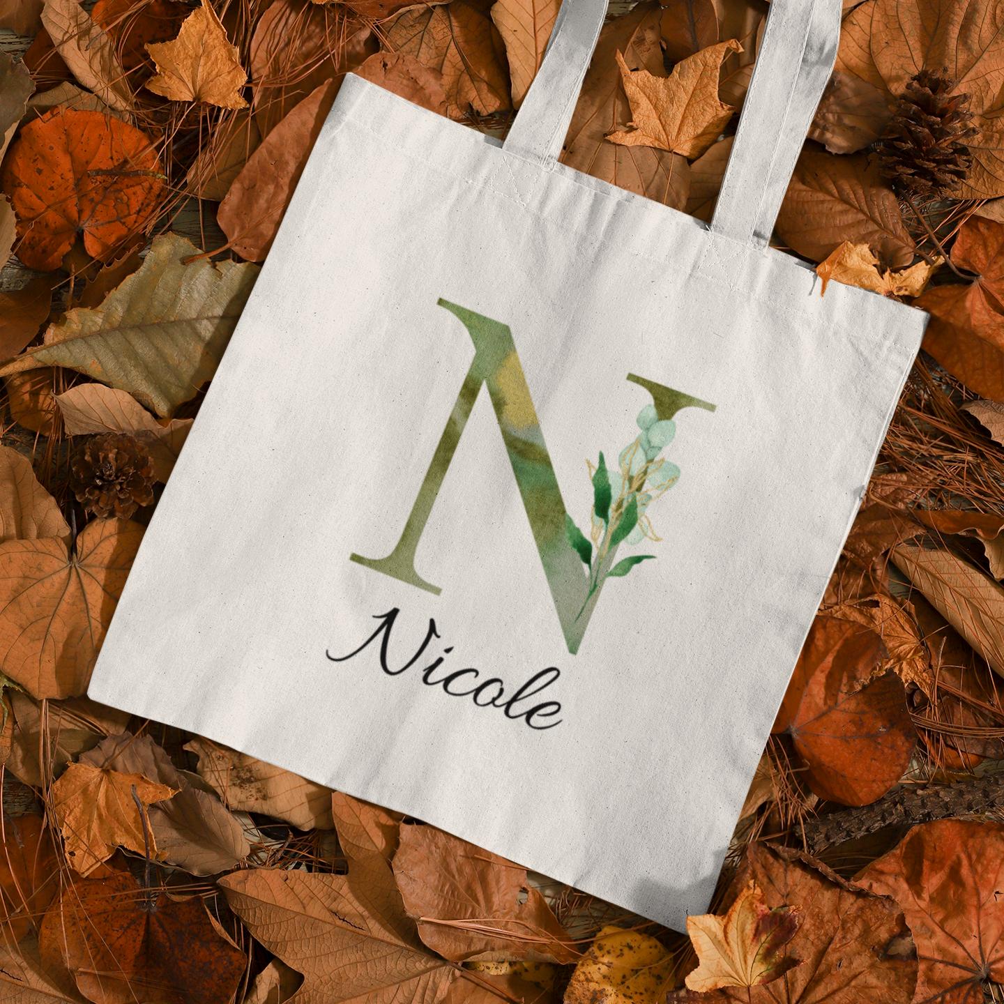 Personalized tote bag with olive green foliage letter N and name Nicole, eco-friendly botanical canvas bag in autmn leaves