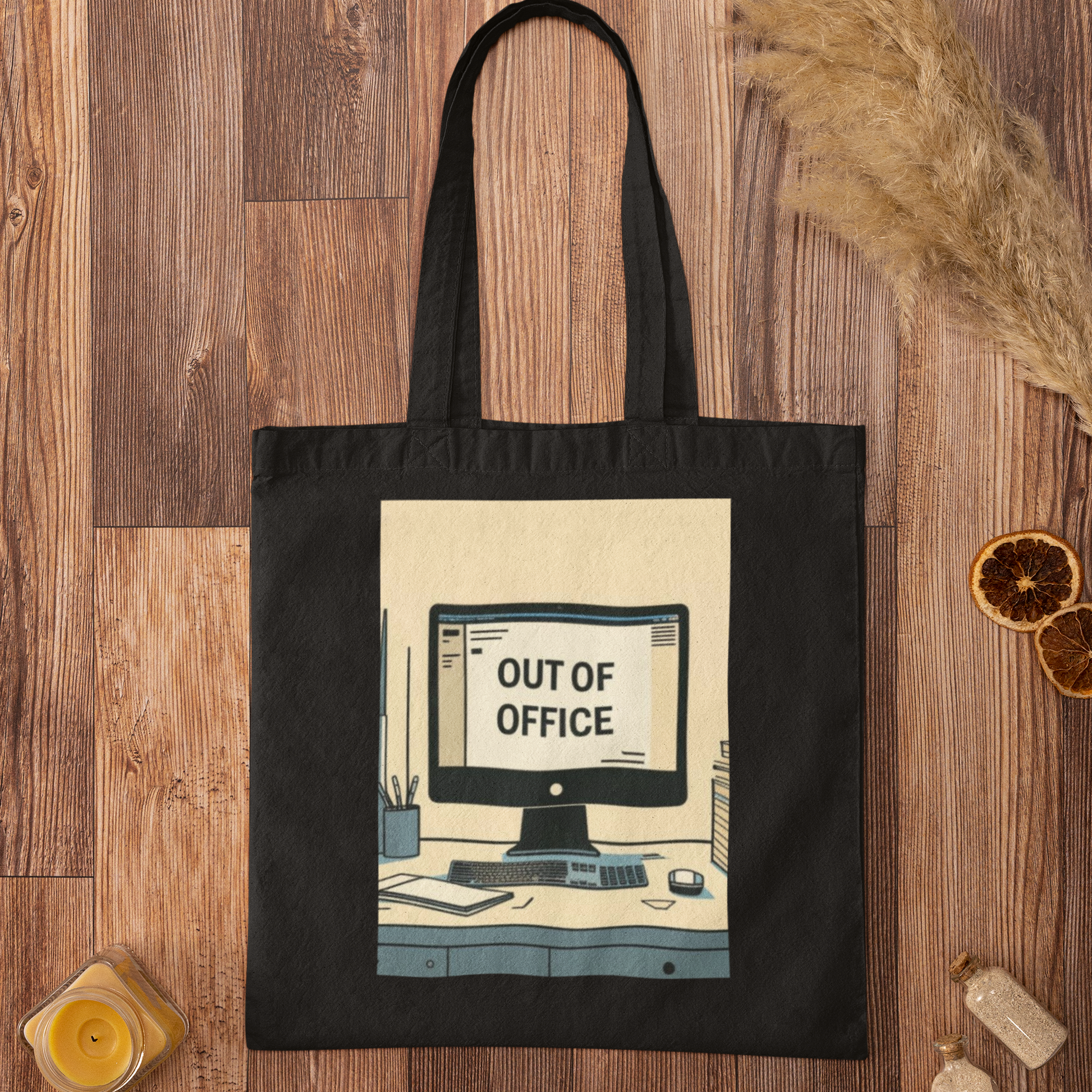 Black Out of Office Design Graphic Tote Bag flatlay on rustic wooden background with minimalist decor