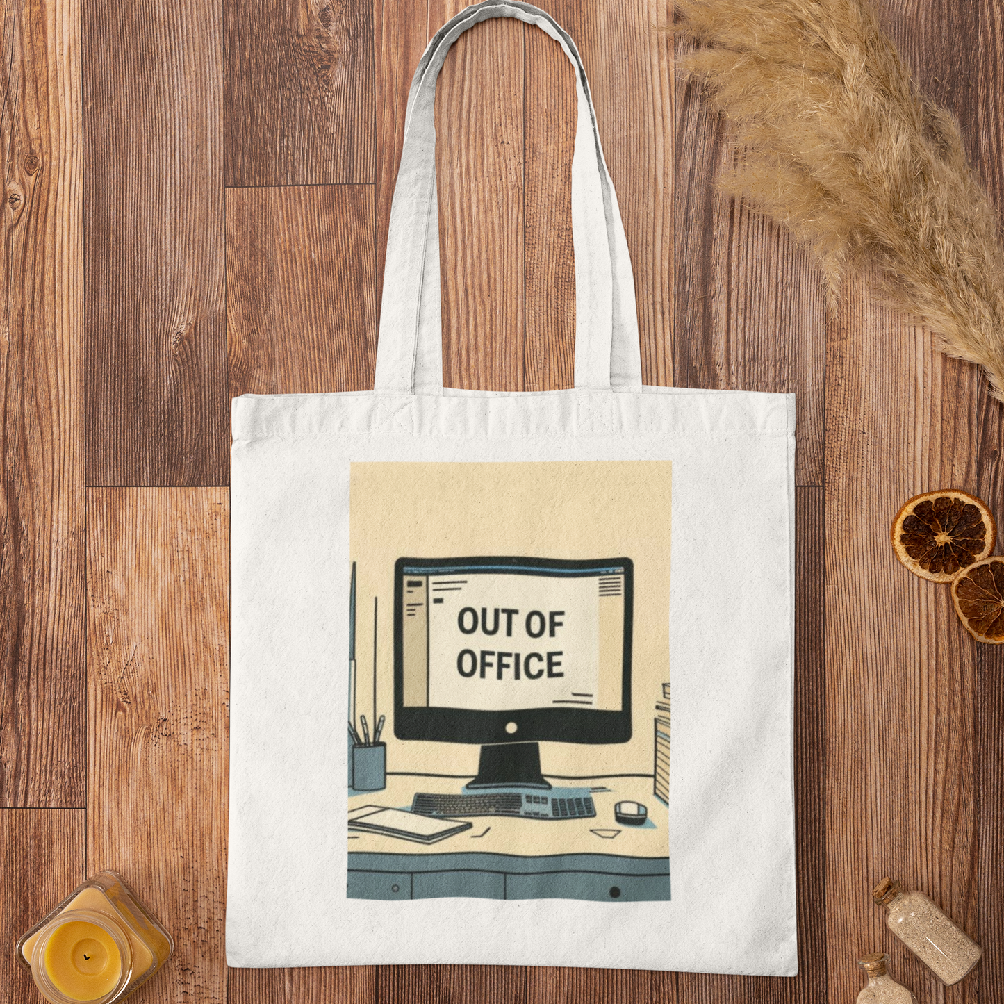 White Out of Office Design Graphic Tote Bag flatlay on wood surface showing modern desk print illustration