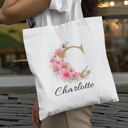 Personalised tote bag with letter C and name Charlotte, gold floral initial with soft pink pastel flowers
