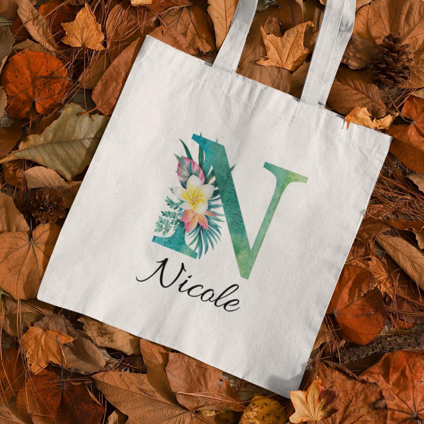 Plumeria Tropical Floral Custom Tote Bag with Emerald Green Initial N, personalized name Nicole, autumn background