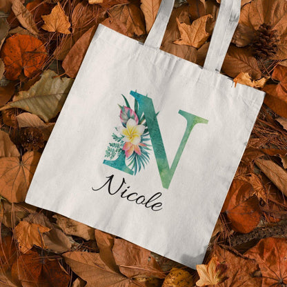 Plumeria Tropical Floral Custom Tote Bag with Emerald Green Initial N, personalized name Nicole, autumn background
