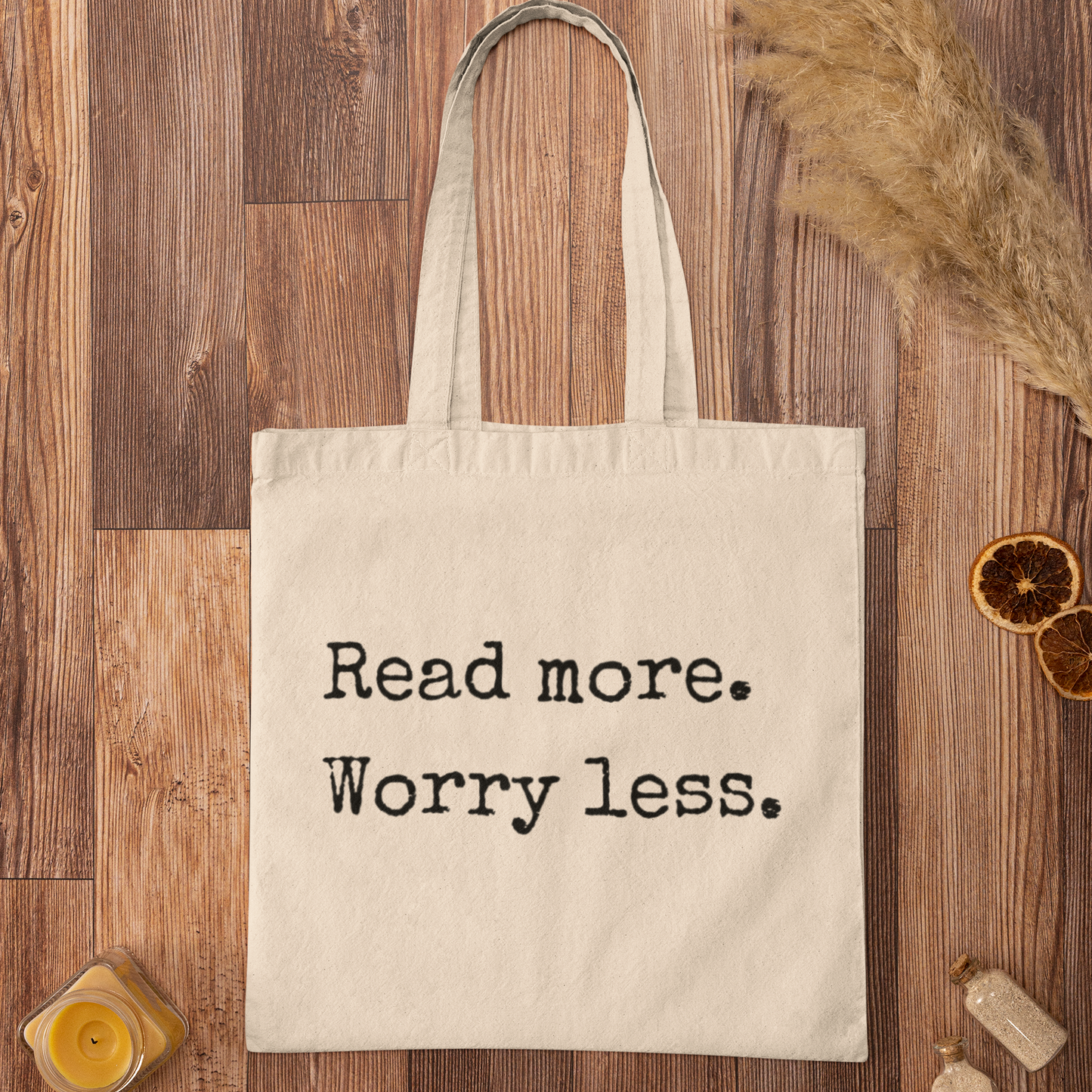 Natural canvas tote bag with ‘Read more. Worry less.’ reading quote – eco-friendly minimalist style