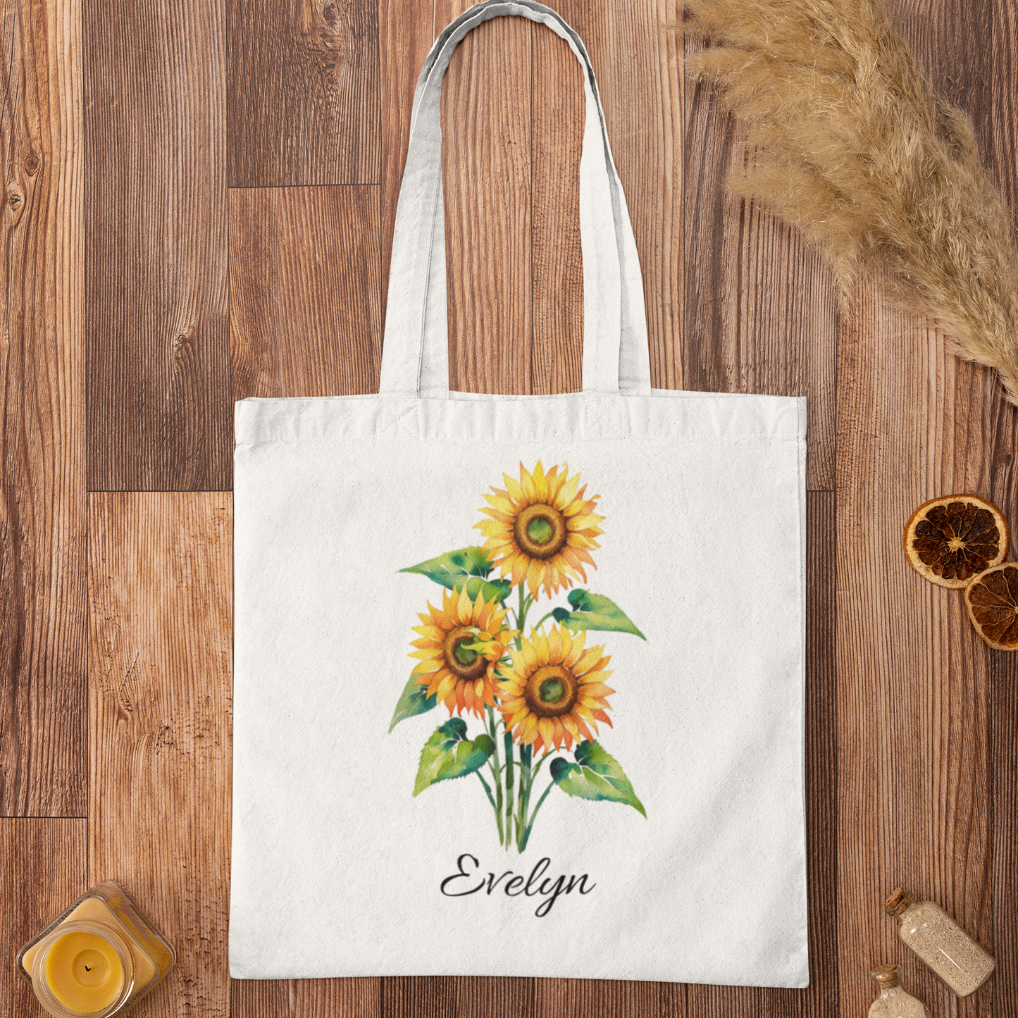 Sunflower Print Custom Name Floral Tote Bag personalized with Evelyn shown in flat-lay product mockup