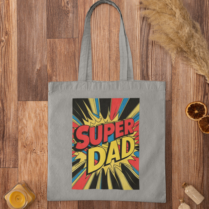 Gray tote bag with 'Super Dad' design on a wooden surface