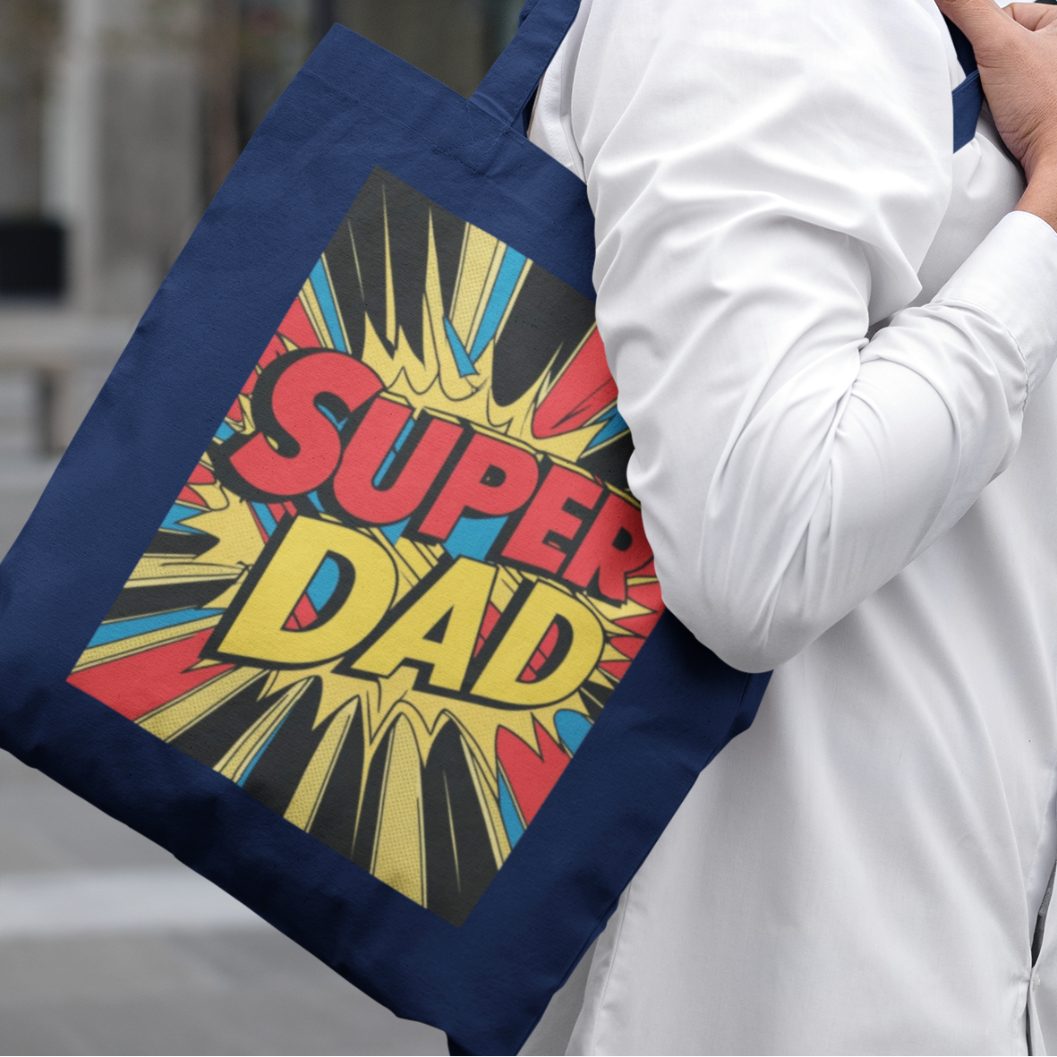 Man carrying navy Super Dad Retro Gift Tote Bag, comic-style dad gift tote for Father’s Day
