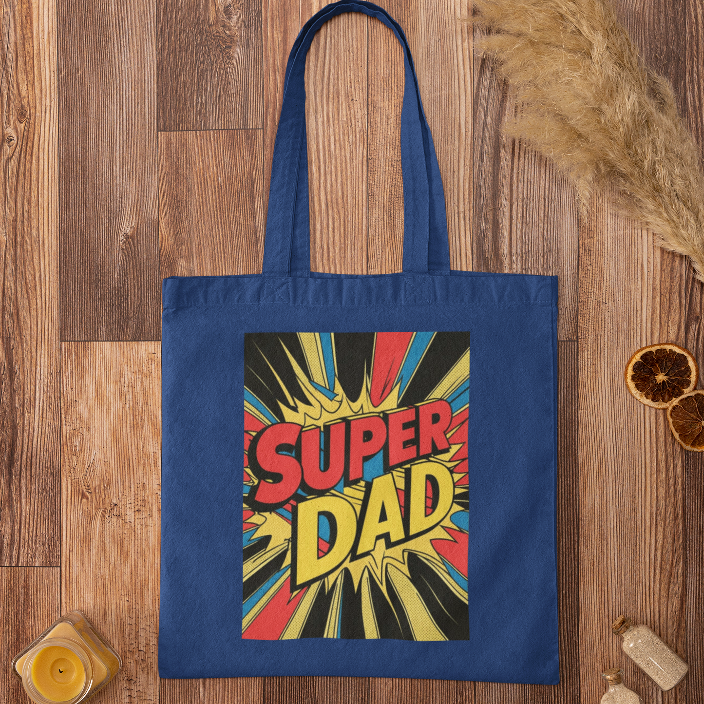 Blue tote bag with 'Super Dad' design on a wooden surface