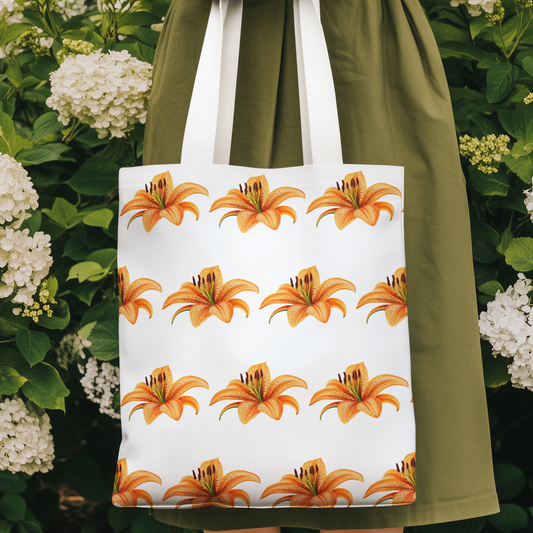 Woman holding Tiger Lily Flower Design Patterned Tote Bag in a floral garden setting