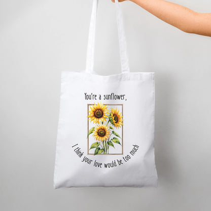 Tote bag with sunflower design and text on a white background